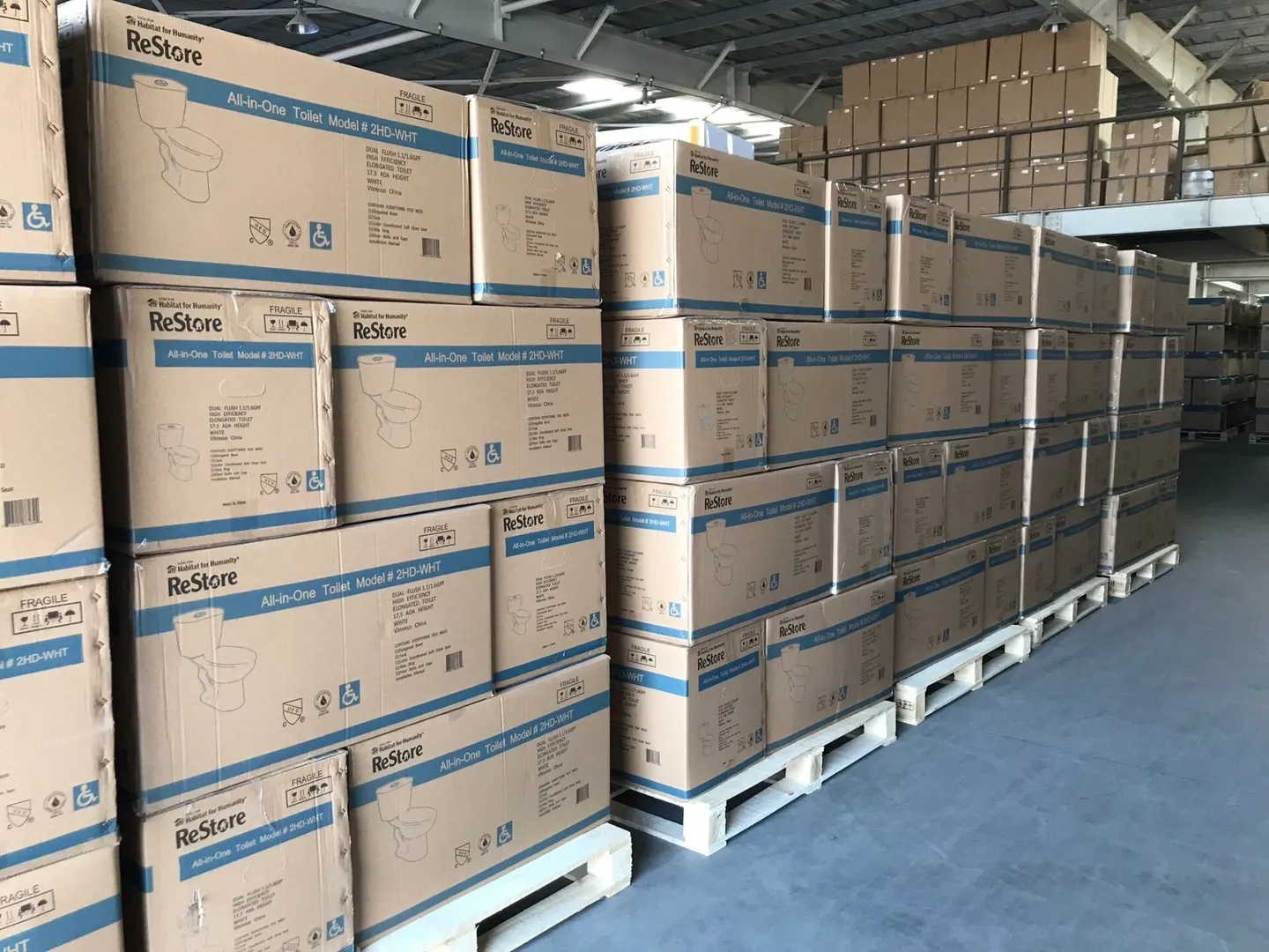 Warehouse stocked with Re-Store All-in-One Toilet Model units